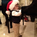 Rocco Claus at the piano on Christmas Eve