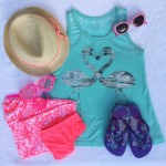 Think flamingos, sparkles, and rash guards for Chic Travel Gear for Girls.